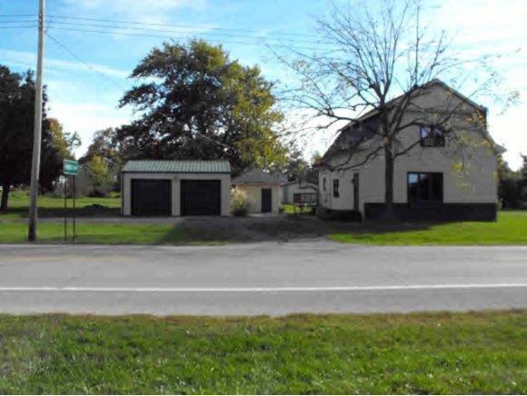 16 Rt Tower Hill Tower Hill, IL 62571 - Photo 1 of 1 a front view of a house with a garden and yard
