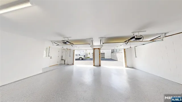 a view of a storage & utility room with windows