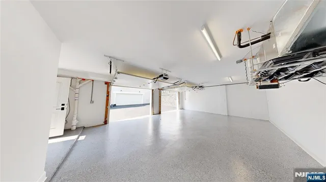 a view of a room with gym equipment and a window