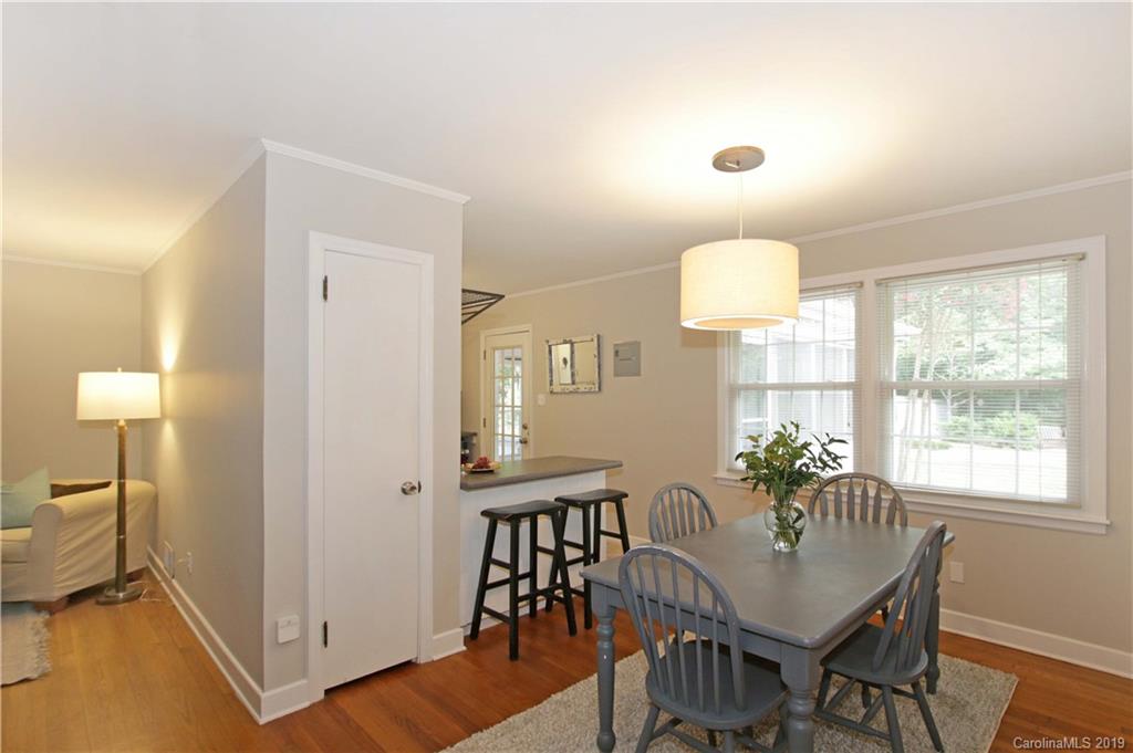 4137 Applegate Road Charlotte, NC 28209 - Photo 11 of 44 a view of a dining room with furniture window and wooden floor