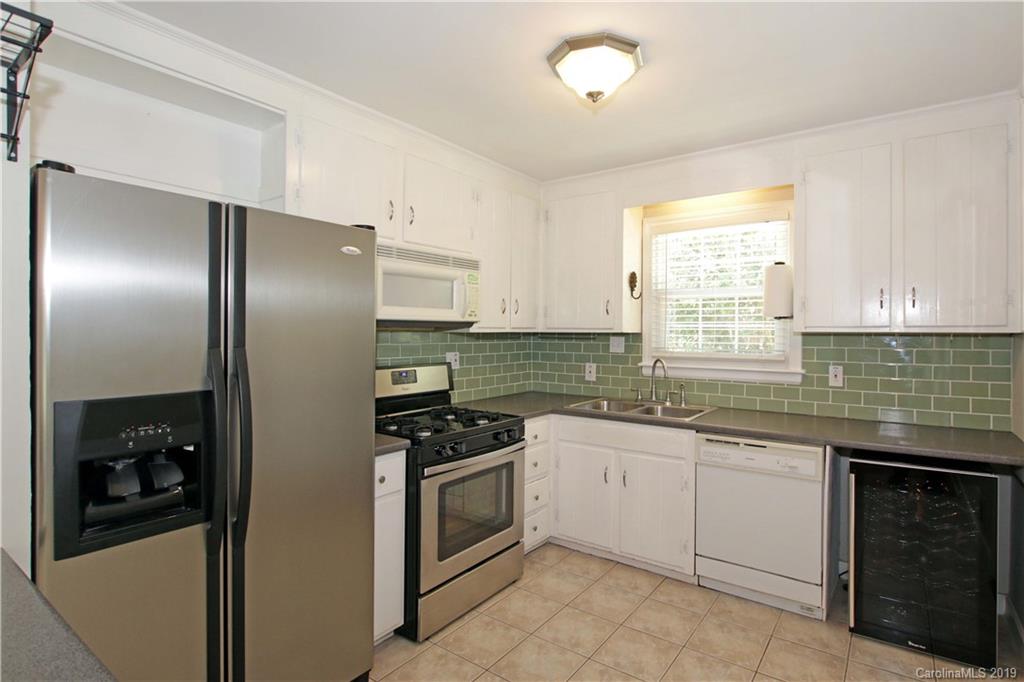 4137 Applegate Road Charlotte, NC 28209 - Photo 13 of 44 a kitchen with granite countertop stainless steel appliances a sink and cabinets