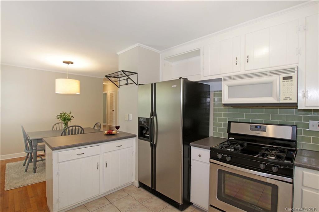 4137 Applegate Road Charlotte, NC 28209 - Photo 14 of 44 a kitchen with a refrigerator stove and sink