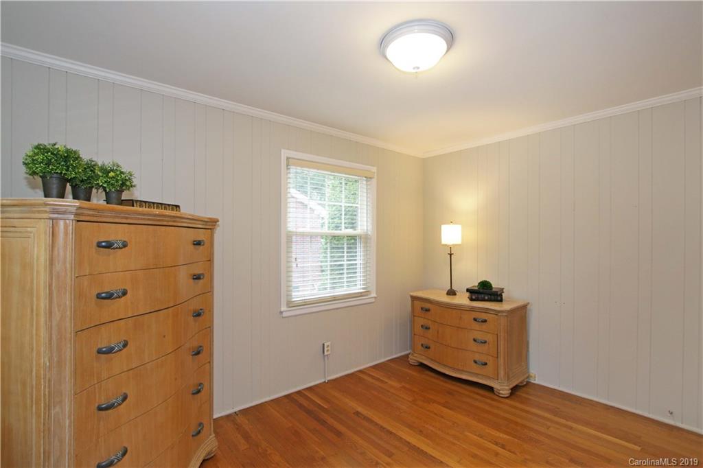 4137 Applegate Road Charlotte, NC 28209 - Photo 18 of 44 a room with a dresser and a window