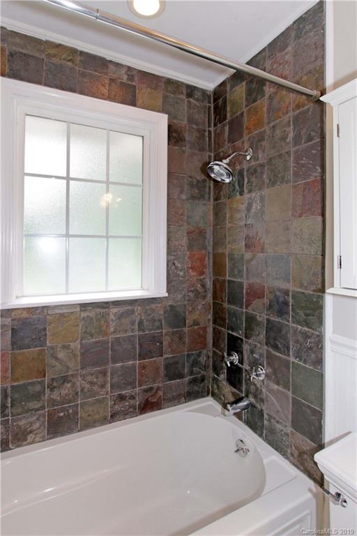 4137 Applegate Road Charlotte, NC 28209 - Photo 20 of 44 a bathroom with a bathtub and shower