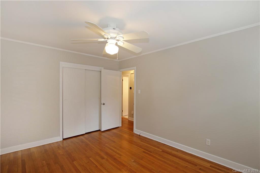 4137 Applegate Road Charlotte, NC 28209 - Photo 21 of 44 an empty room with wooden floor and fan