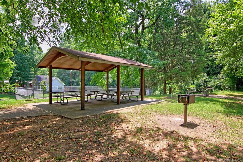 4137 Applegate Road Charlotte, NC 28209 - Photo 41 of 44 a backyard of a house with table and chairs
