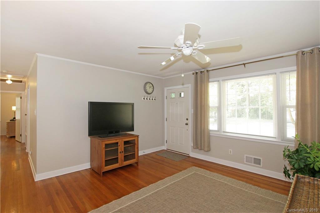 4137 Applegate Road Charlotte, NC 28209 - Photo 9 of 44 a living room with a flat screen tv and a window
