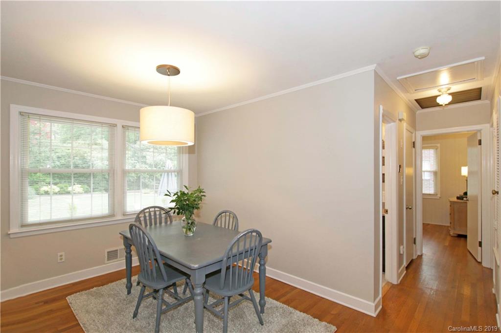4137 Applegate Road Charlotte, NC 28209 - Photo 10 of 44 a view of a dining room with furniture window and wooden floor