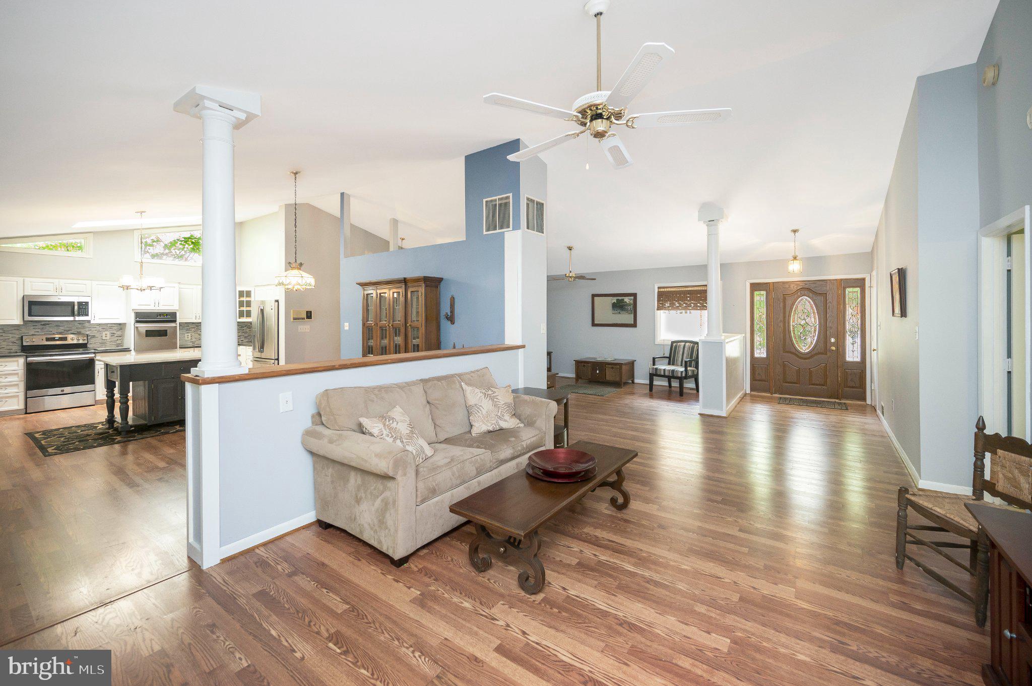 110 Federal Road Locust Grove, VA 22508 - Photo 17 of 77 a living room with couches and kitchen view with wooden floor