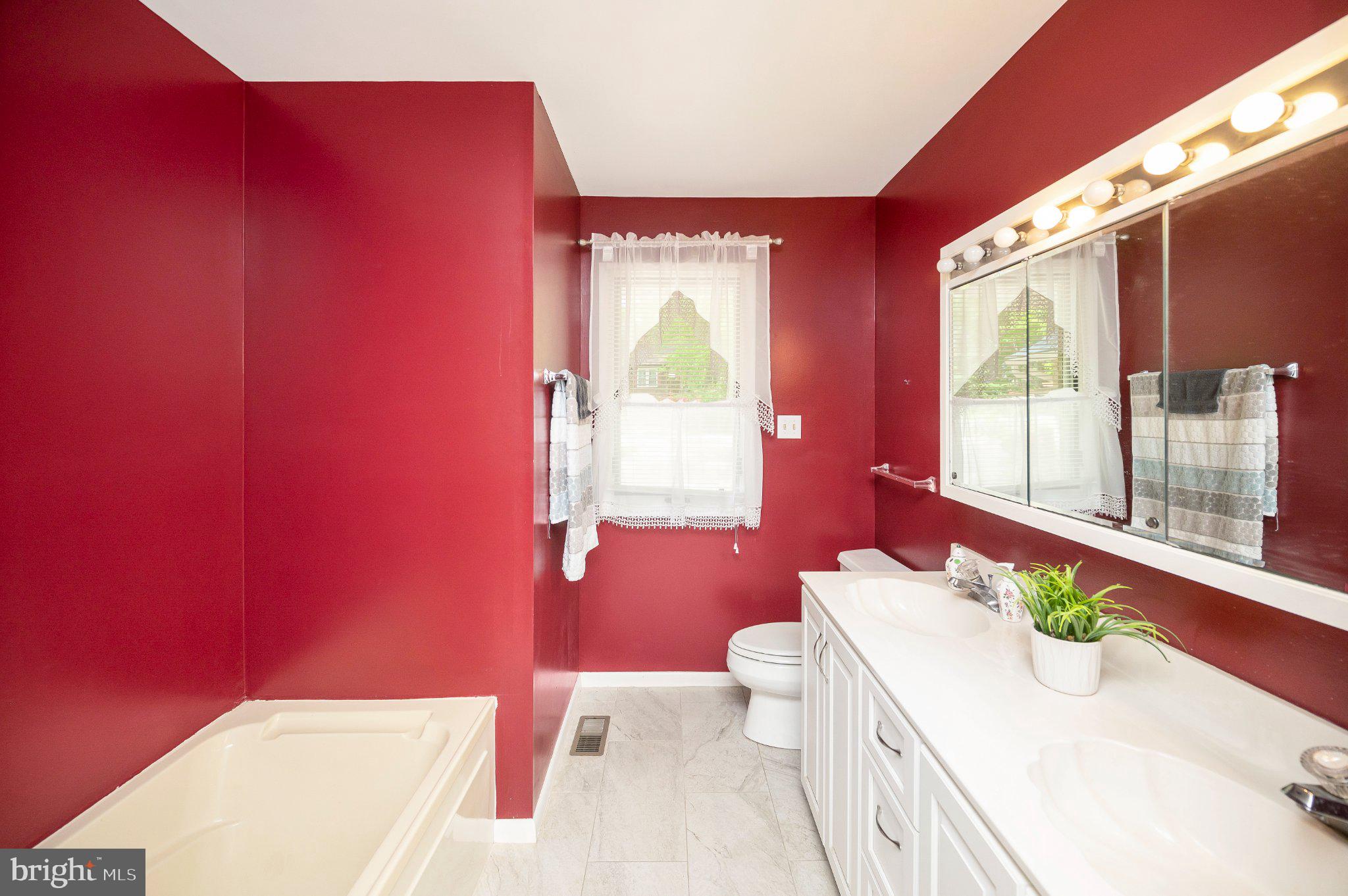 110 Federal Road Locust Grove, VA 22508 - Photo 33 of 77 Bold red elegance in a modern bath.