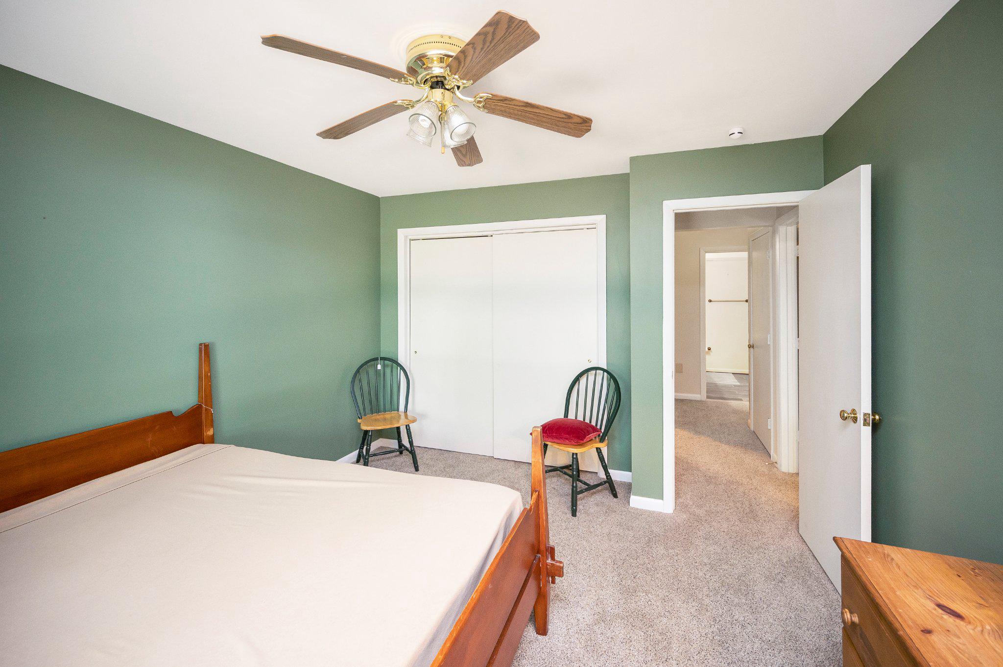 110 Federal Road Locust Grove, VA 22508 - Photo 40 of 77 a bedroom with a bed and a chandelier