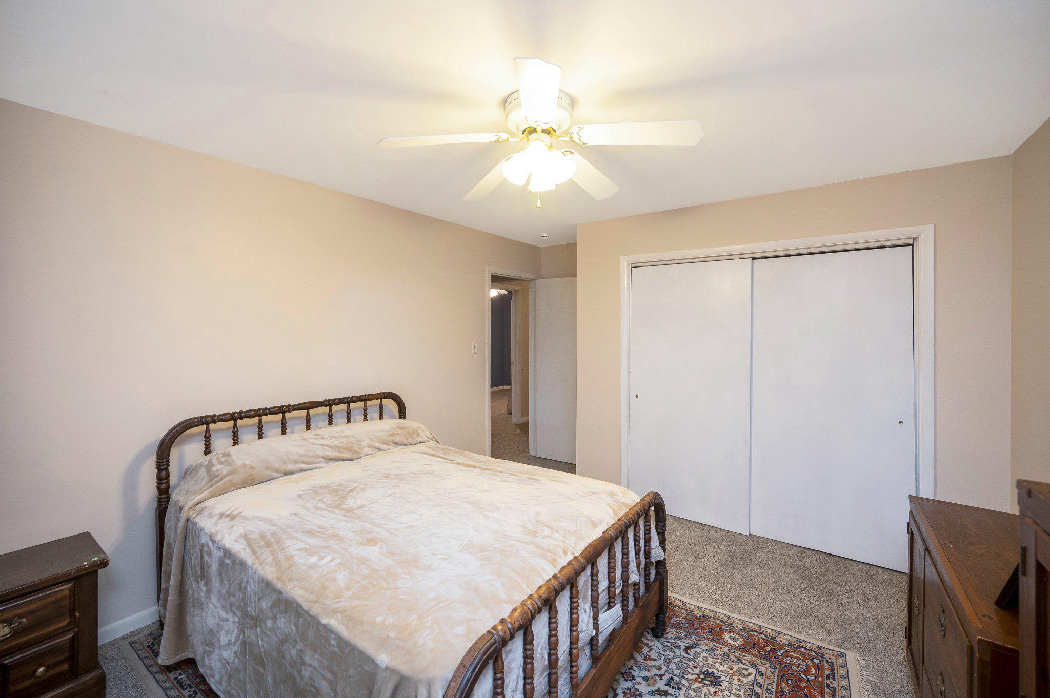 110 Federal Road Locust Grove, VA 22508 - Photo 43 of 77 a bedroom with a bed and a chandelier