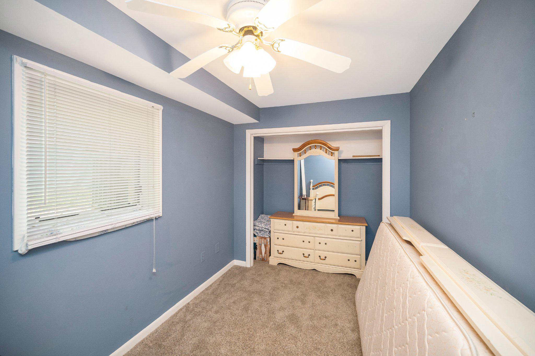 110 Federal Road Locust Grove, VA 22508 - Photo 45 of 77 a bedroom with a bed and a chandelier