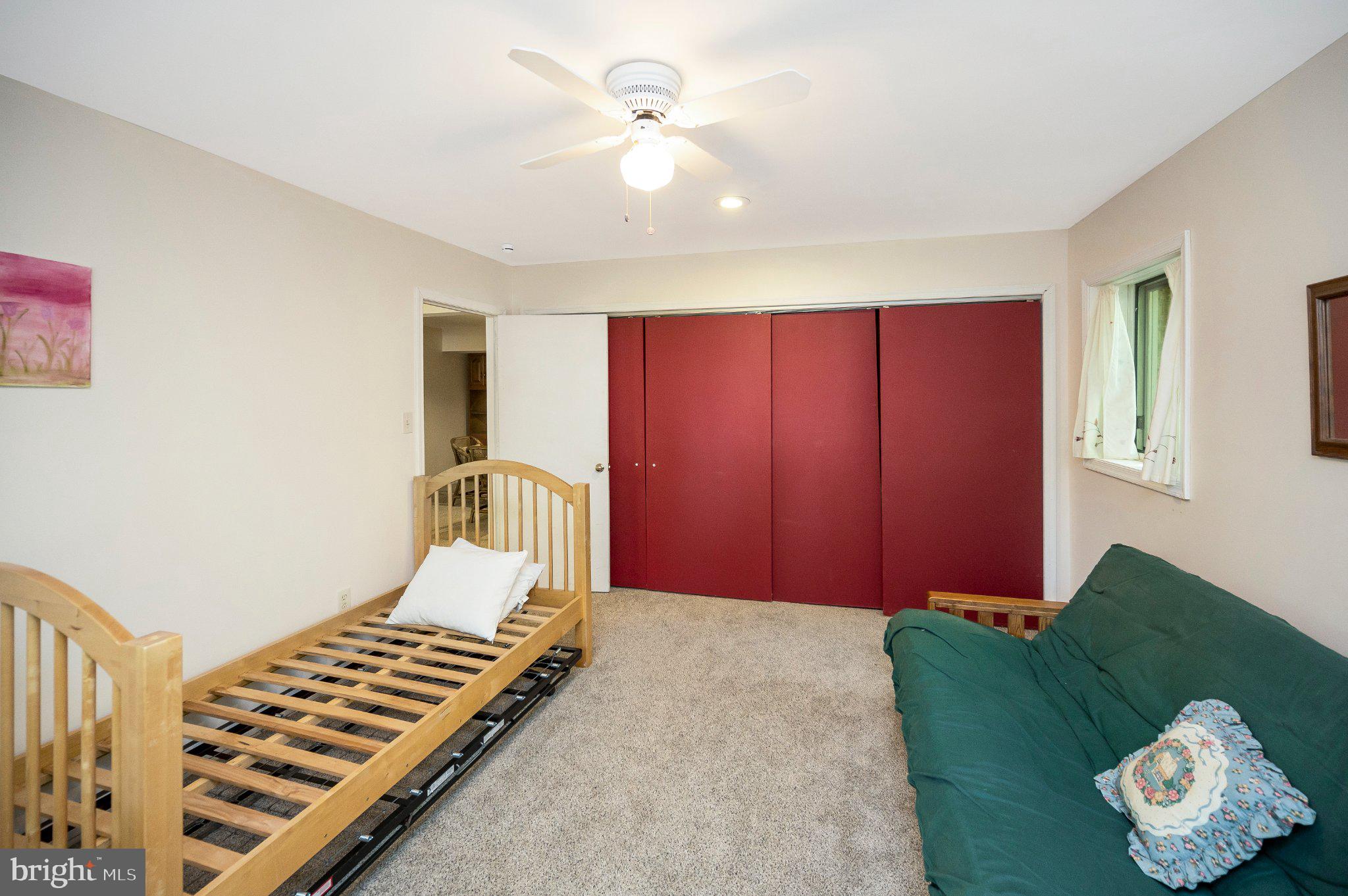 110 Federal Road Locust Grove, VA 22508 - Photo 48 of 77 a bedroom with a bed and a chandelier