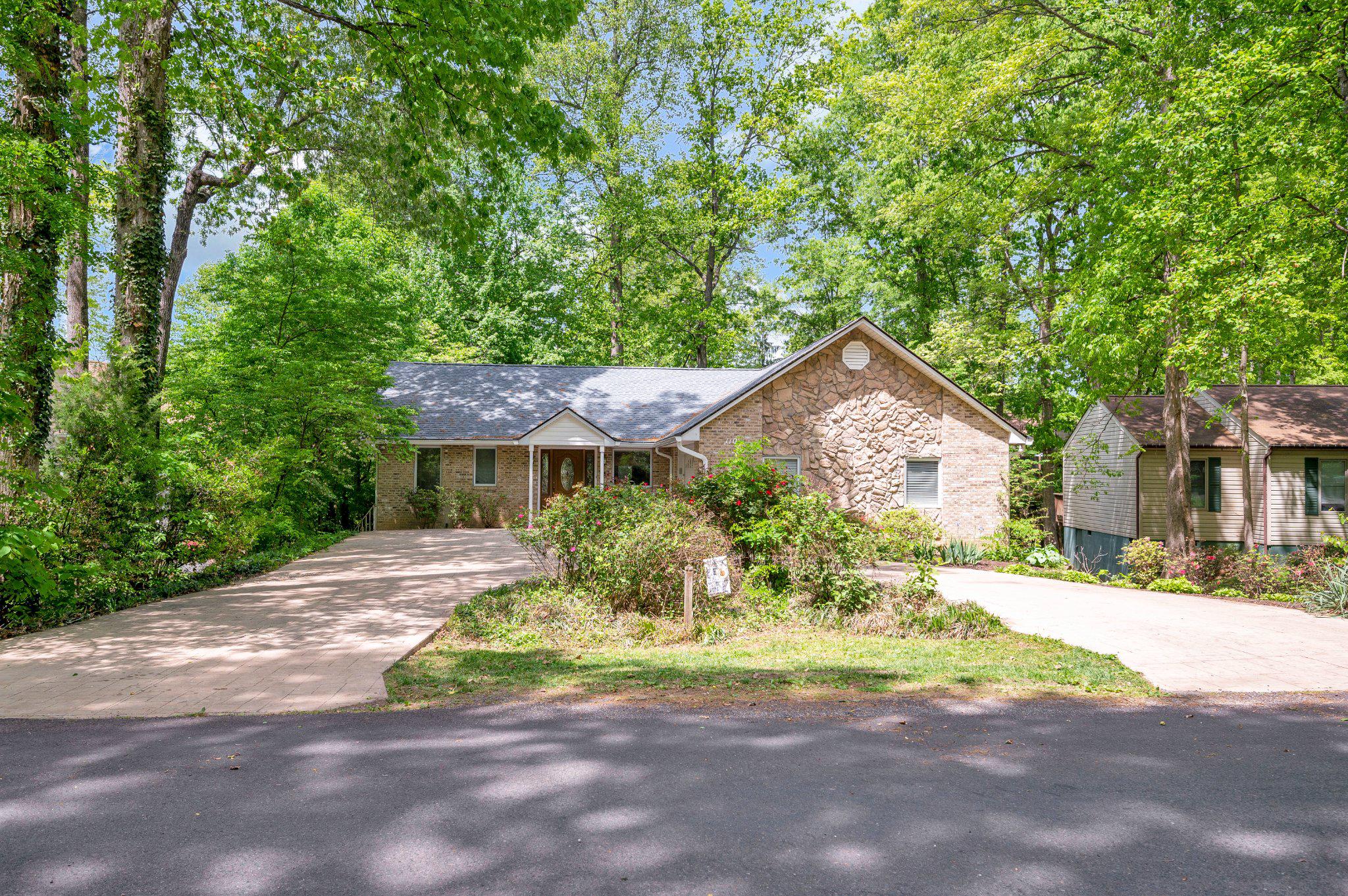 110 Federal Road Locust Grove, VA 22508 - Photo 5 of 77 a front view of a house with a yard and potted plants