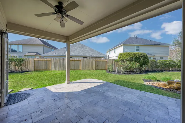 a front view of a house with a garden and yard