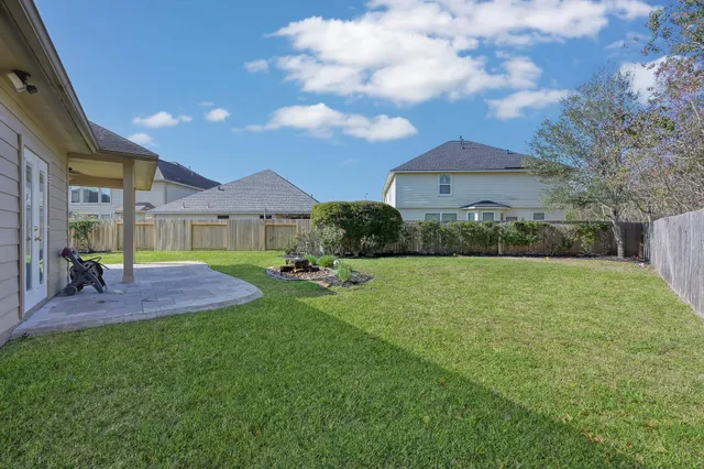 a backyard of a house with lots of green space