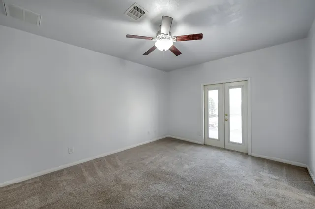 a view of a backyard with a garden and plants