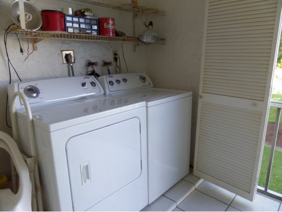 5467 Rattlesnake Hammock Road, Unit 204 Naples, FL 34113 - Photo 12 of 13 a utility room with dryer and washer