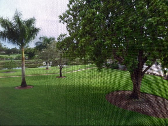 5467 Rattlesnake Hammock Road, Unit 204 Naples, FL 34113 - Photo 7 of 13 a park with lots of green space and trees