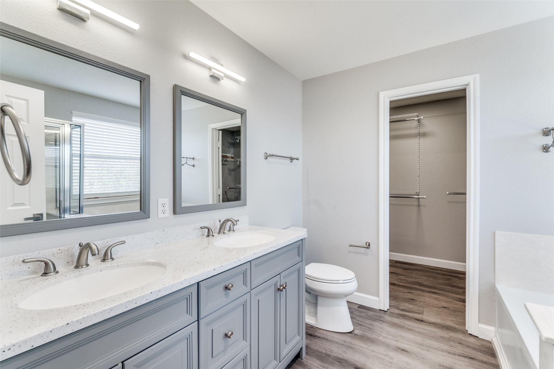 1408 Poppy Seed Lane Austin, TX 78741 - Photo 11 of 23 a bathroom with a granite countertop sink mirror and a toilet