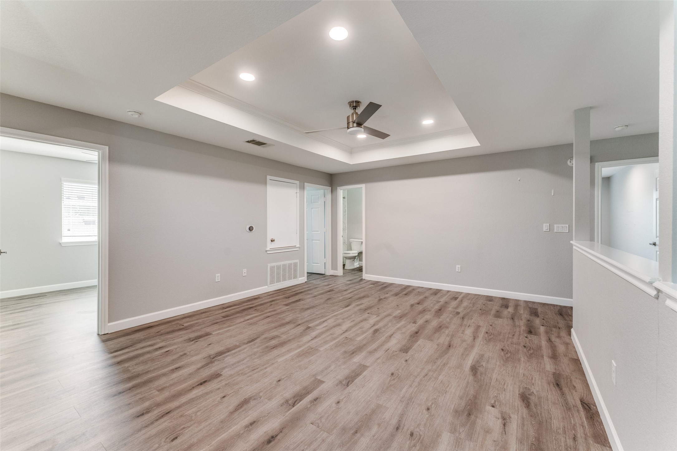 1408 Poppy Seed Lane Austin, TX 78741 - Photo 19 of 23 wooden floor in an empty room with a window