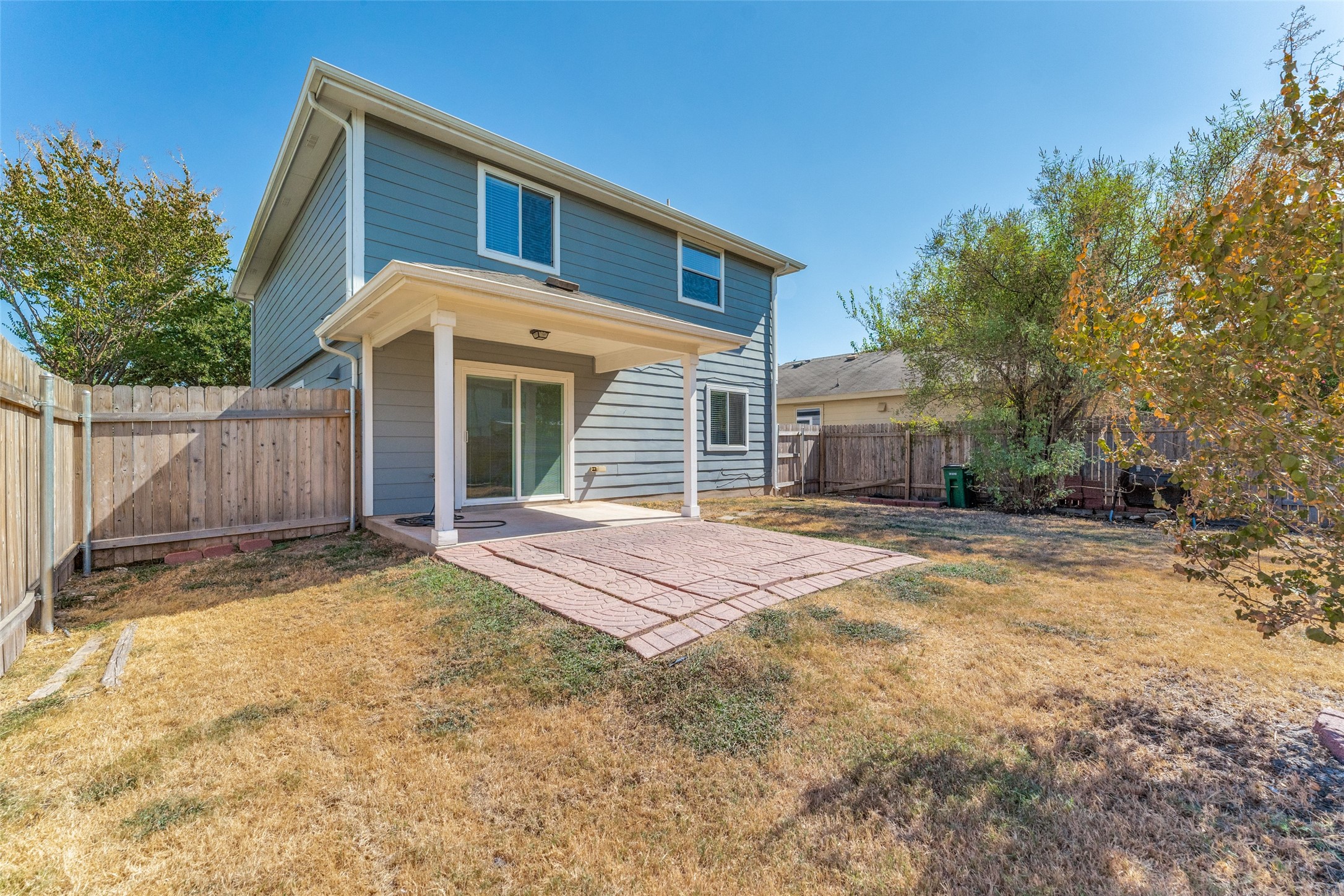 1408 Poppy Seed Lane Austin, TX 78741 - Photo 23 of 23 a front view of a house with a yard and garage
