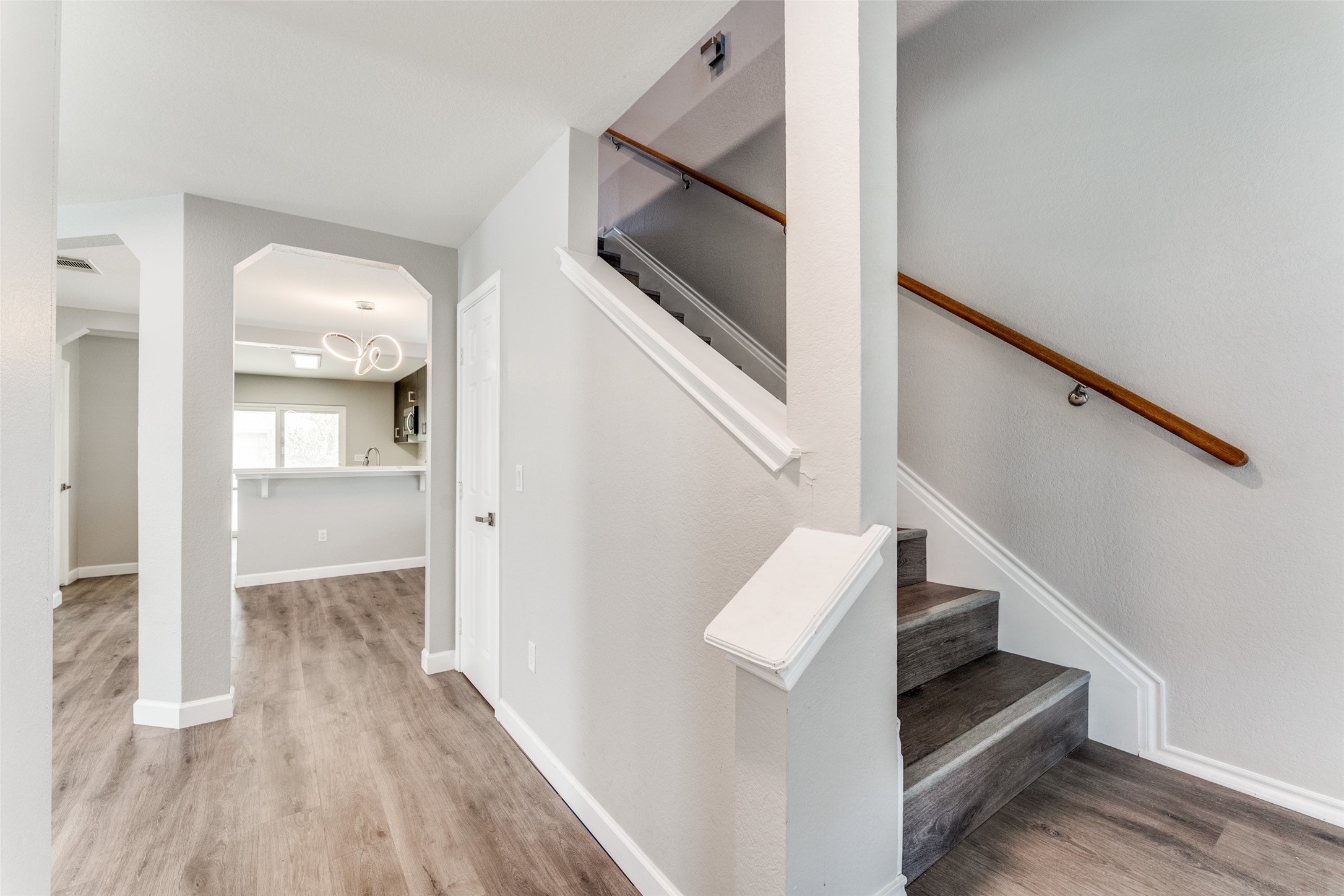 1408 Poppy Seed Lane Austin, TX 78741 - Photo 5 of 23 a view of entryway and hall with wooden floor