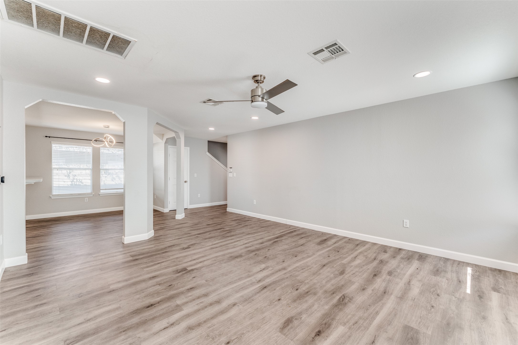 1408 Poppy Seed Lane Austin, TX 78741 - Photo 10 of 23 wooden floor in an empty room with a window