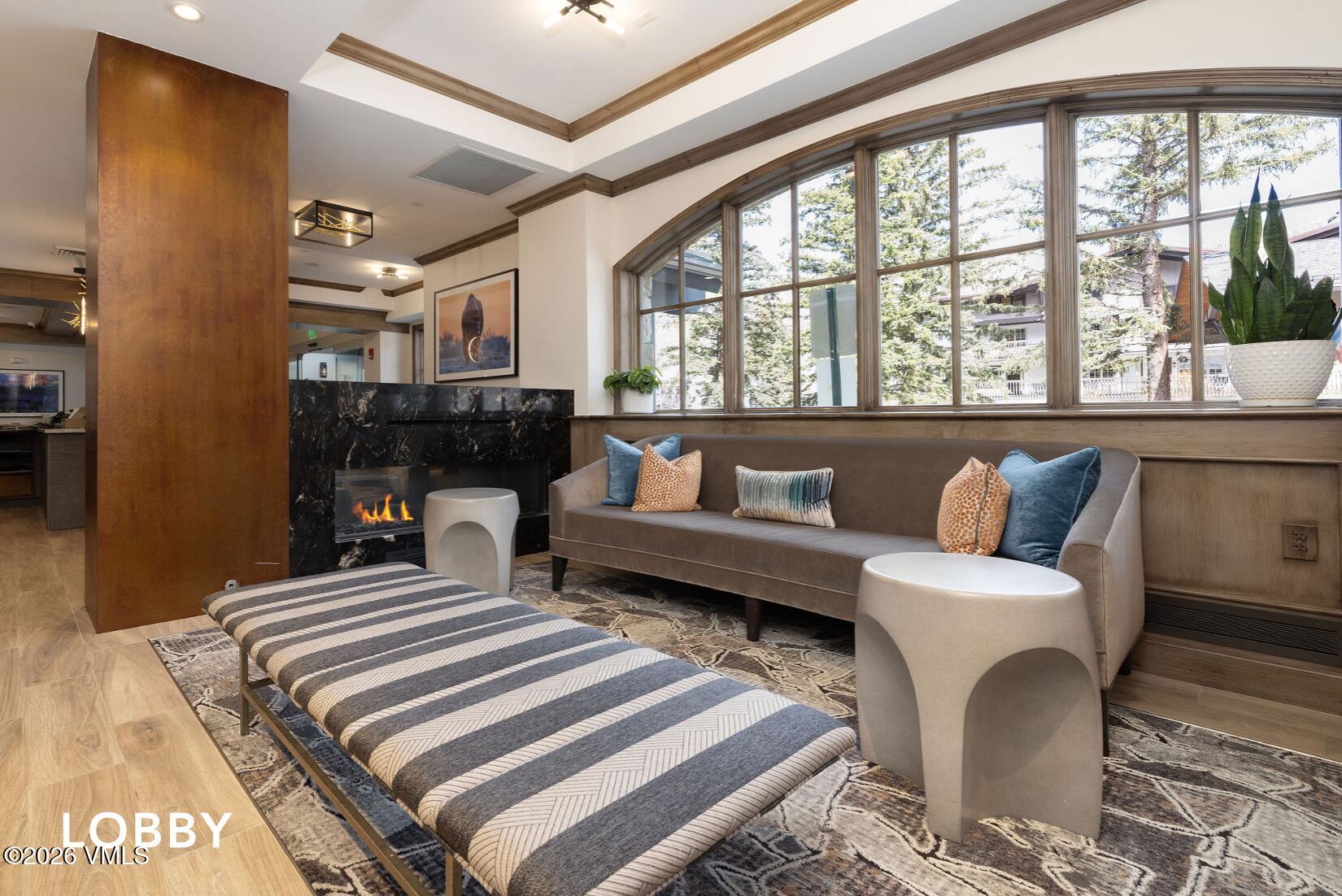 200 Vail Road, Unit 799 Vail, CO 81657 - Photo 21 of 32 a bedroom with a bed and wooden floor
