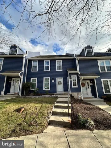 front view of a building with a yard