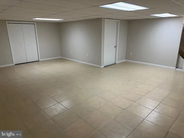 a view of an empty room and a window