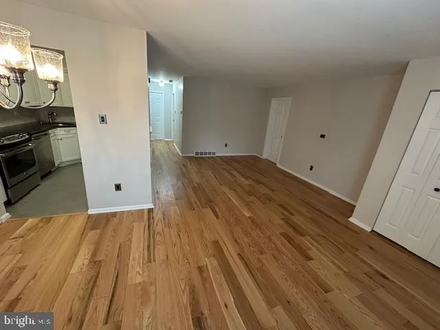 a view of a livingroom with wooden floor