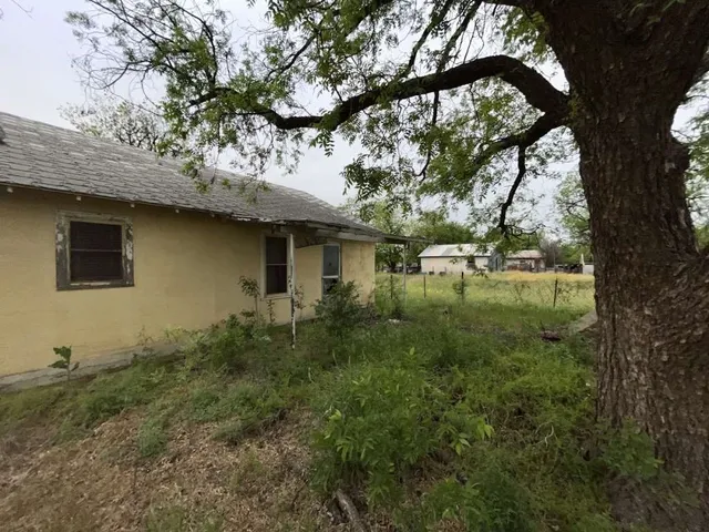 a backyard of a house with lots of green space