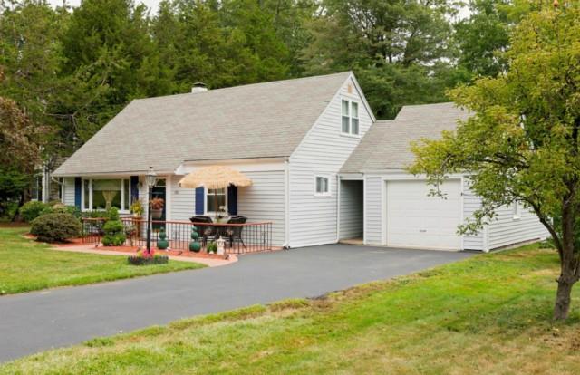 150 Harvester Road Fairfield, CT 06825 - Photo 1 of 1 a view of a house with a patio