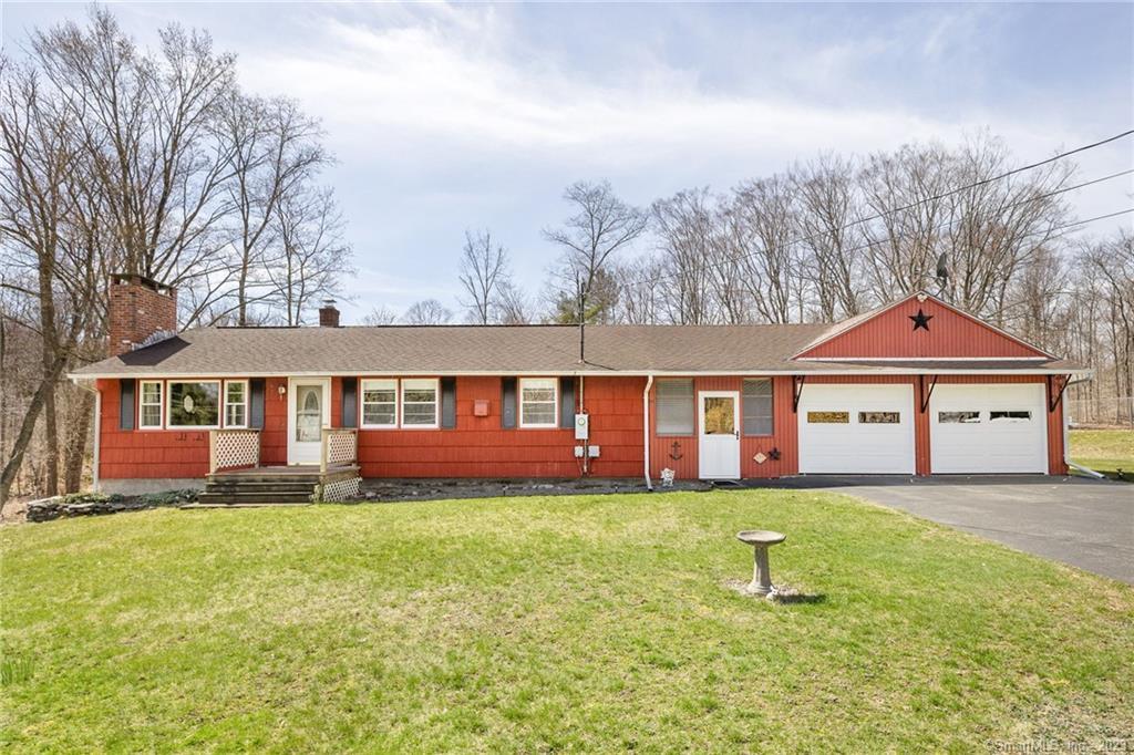 7 Beacon Road Windham, CT 06280 - Photo 1 of 1 a front view of a house with a yard and trees