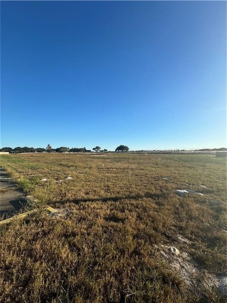 3449 Waldron Road Corpus Christi, TX 78418 - Photo 2 of 3 a view of a large building with an ocean view