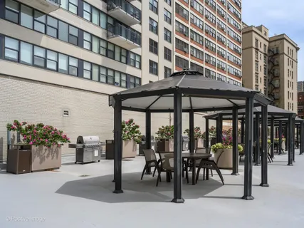 a view of a building with sitting area