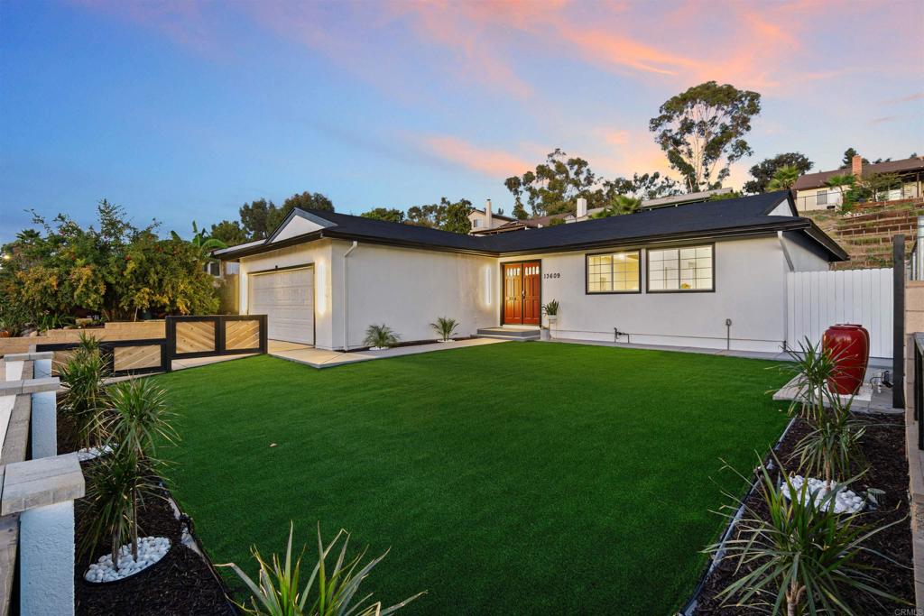 13609 Carriage Road Poway, CA 92064 - Photo 1 of 1 a front view of a house with a garden