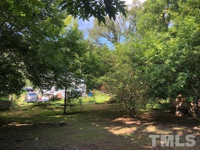 2011 Angier Avenue Durham, NC 27703 - Photo 11 of 15 a view of a yard with a tree