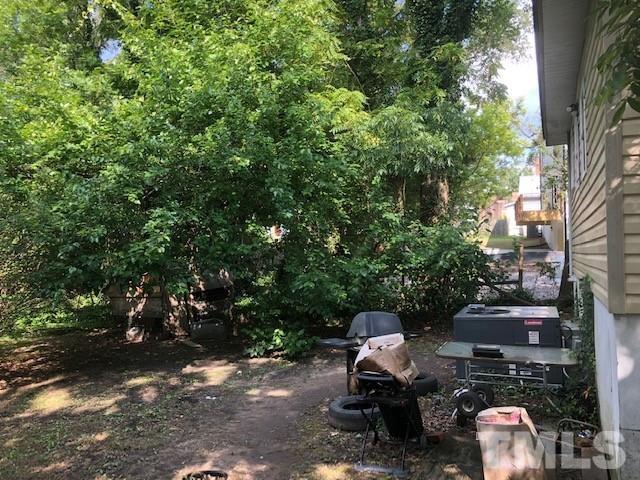 2011 Angier Avenue Durham, NC 27703 - Photo 10 of 15 a view of backyard with outdoor seating and trees