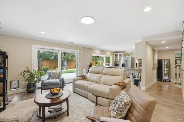 a front view of a house with a yard and a garden