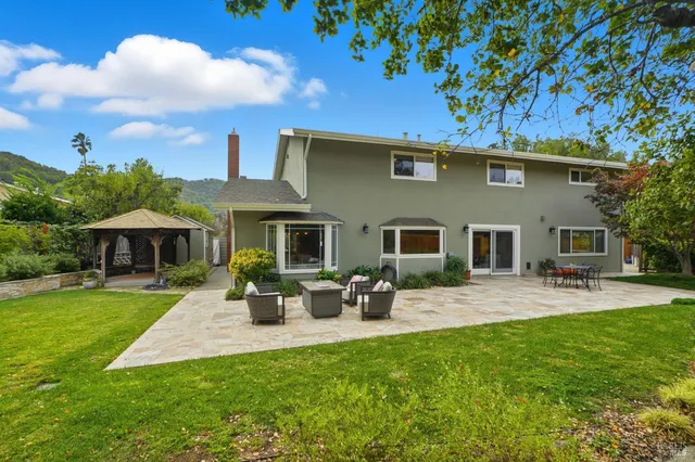 a bathroom with a granite countertop sink mirror and vanity