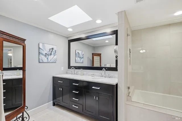 a picture of a bathroom with mirror door