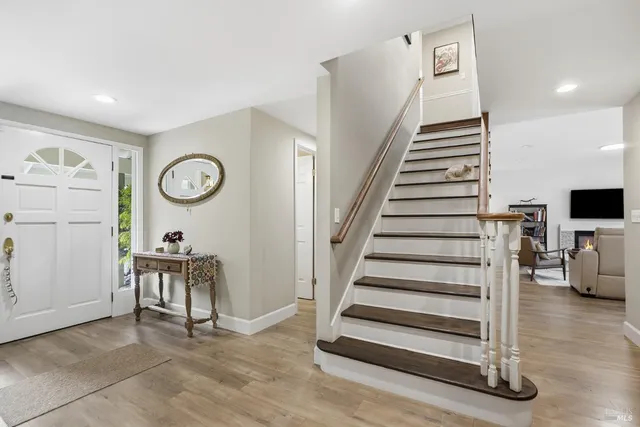 a kitchen with sink and refrigerator