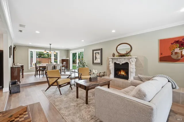 a kitchen with white cabinets and sink
