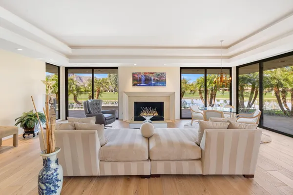 a living room with furniture and next to a window