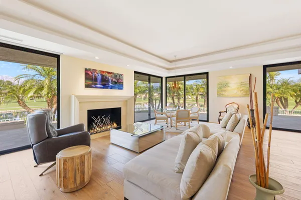 a dining room with furniture a livingroom and chandelier