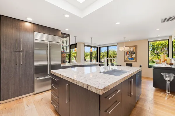 a bathroom with a granite countertop sink mirror and vanity