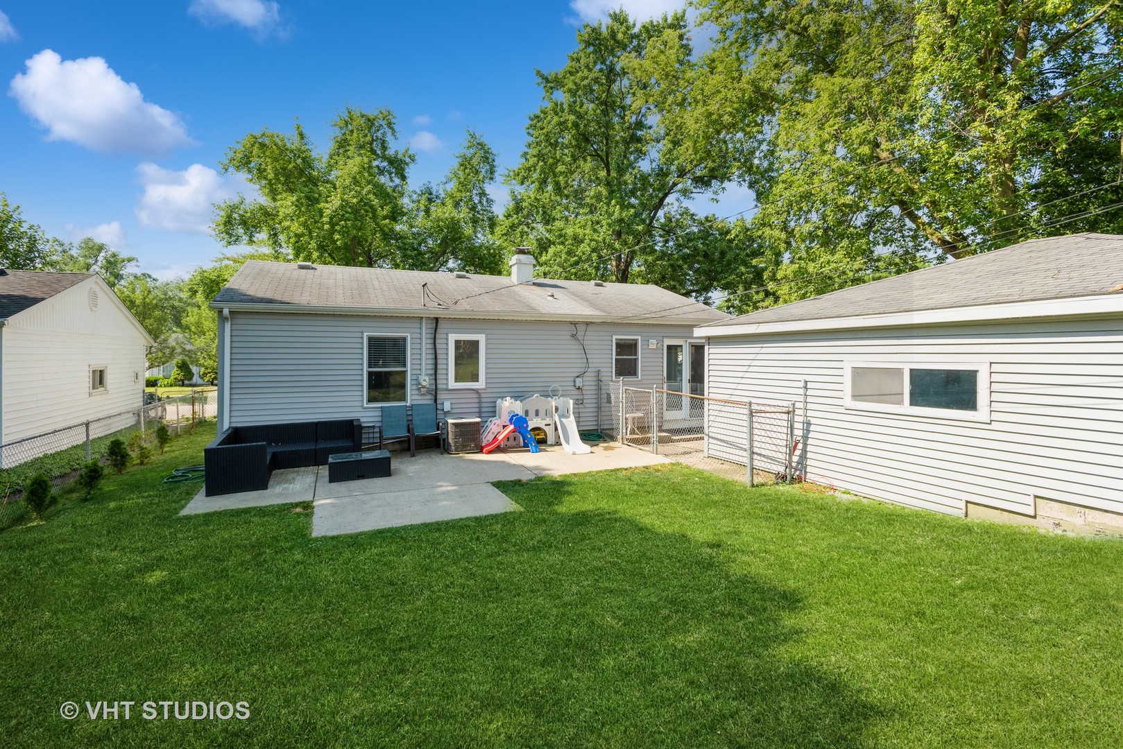 16 East Oltendorf Road Streamwood, IL 60107 - Photo 16 of 18 a front view of house with a garden and patio